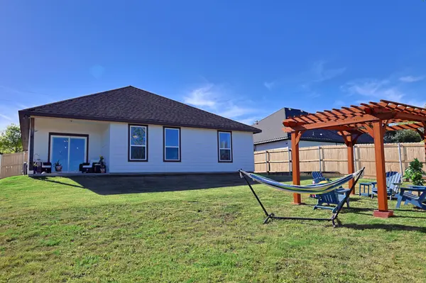 Fantastic outdoor space with covered patio and wide open back yard