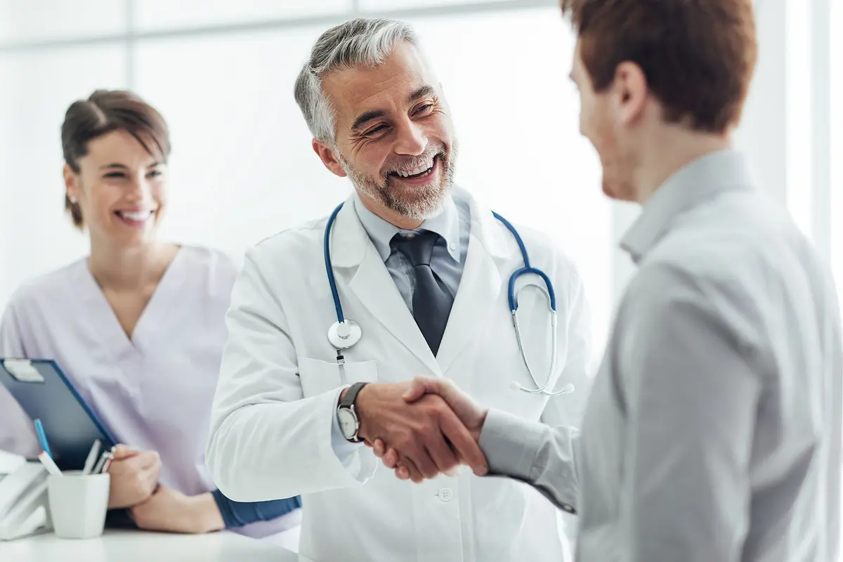 bigstock-Patient-And-Medical-Staff-138539774