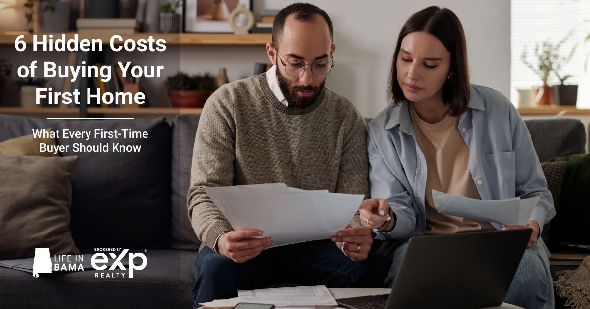 First-time homebuyers reviewing paperwork and budgeting for hidden costs when buying a home in North Alabama
