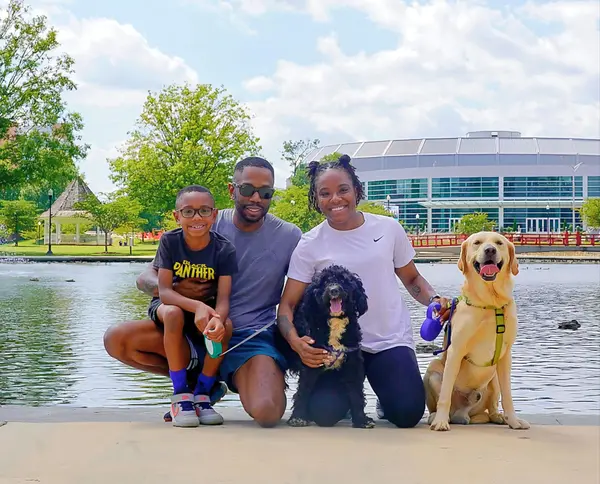 Tavarus McCrary with his family and dogs at Big Spring Park in downtown Huntsville Alabama