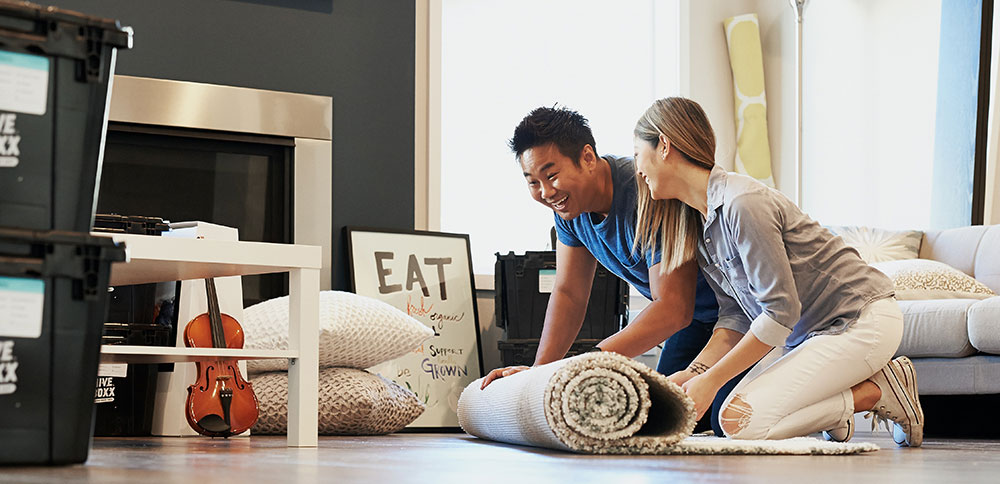 Young couple moving into their first townhouse in Surrey, BC