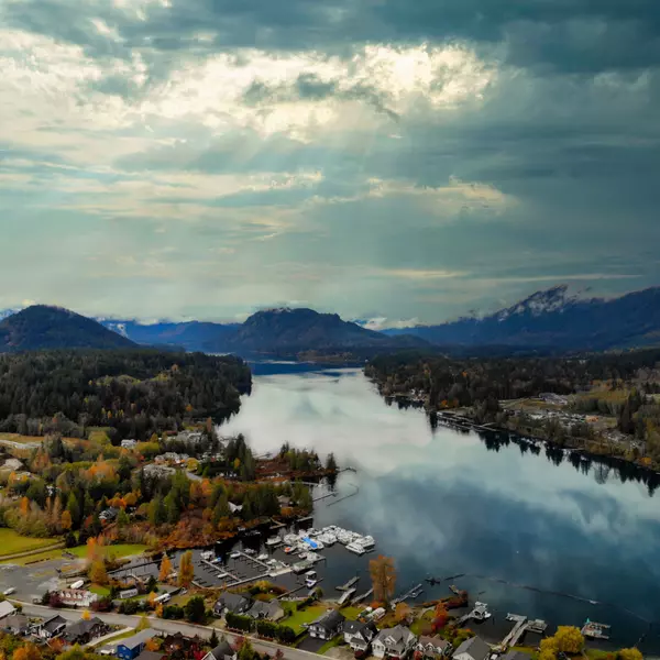 Aerial view of Honeymoon Bay on Vancouver Island, British Columbia, surrounded by autumn forest and mountain scenery