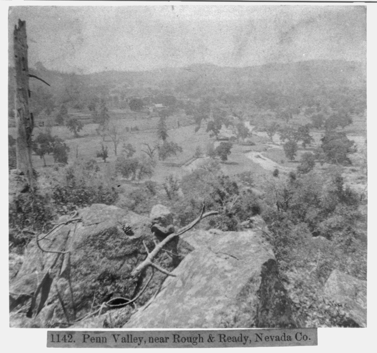 1860s black-and-white stereograph photograph of the rocky, oak-covered Penn Valley landscape near Rough and Ready, where Lake Wildwood was later built