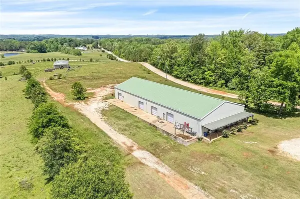 Space, Style & Versatility in Valley, AL – 3.1 Acres, This Property Features 3 Spacious Bedrooms and 3 Full Baths, a Unique Barndominium and Expansive Workshop Ready for Living, Business, or Play!
