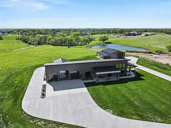 Smithville, MO Barndominium Estate on Nearly 7 Acres – 3 Bedrooms, 2 Baths, and a Luxury Garage Lover’s Dream with a Massive 6-Car Garage, 40x40 Shop & RV Pavilion Built for Big Toys, Big Living & Big