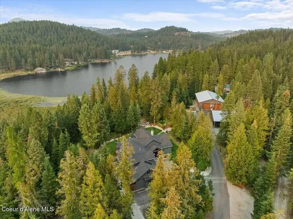 feature image of Kelso Lake Waterfront Luxury Estate in Athol, ID — Showcasing Dual Heated Shops, a Massive Garage, and an Exceptional Multi-Use Lifestyle Setting on 5+ Private Acres of Pristine Lakefront Paradise, Fe