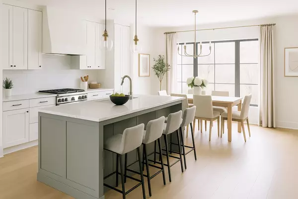 Bright modern kitchen staged for sale, featuring sleek cabinetry, stainless steel appliances, and large windows—ideal for Ontario real estate listings.
