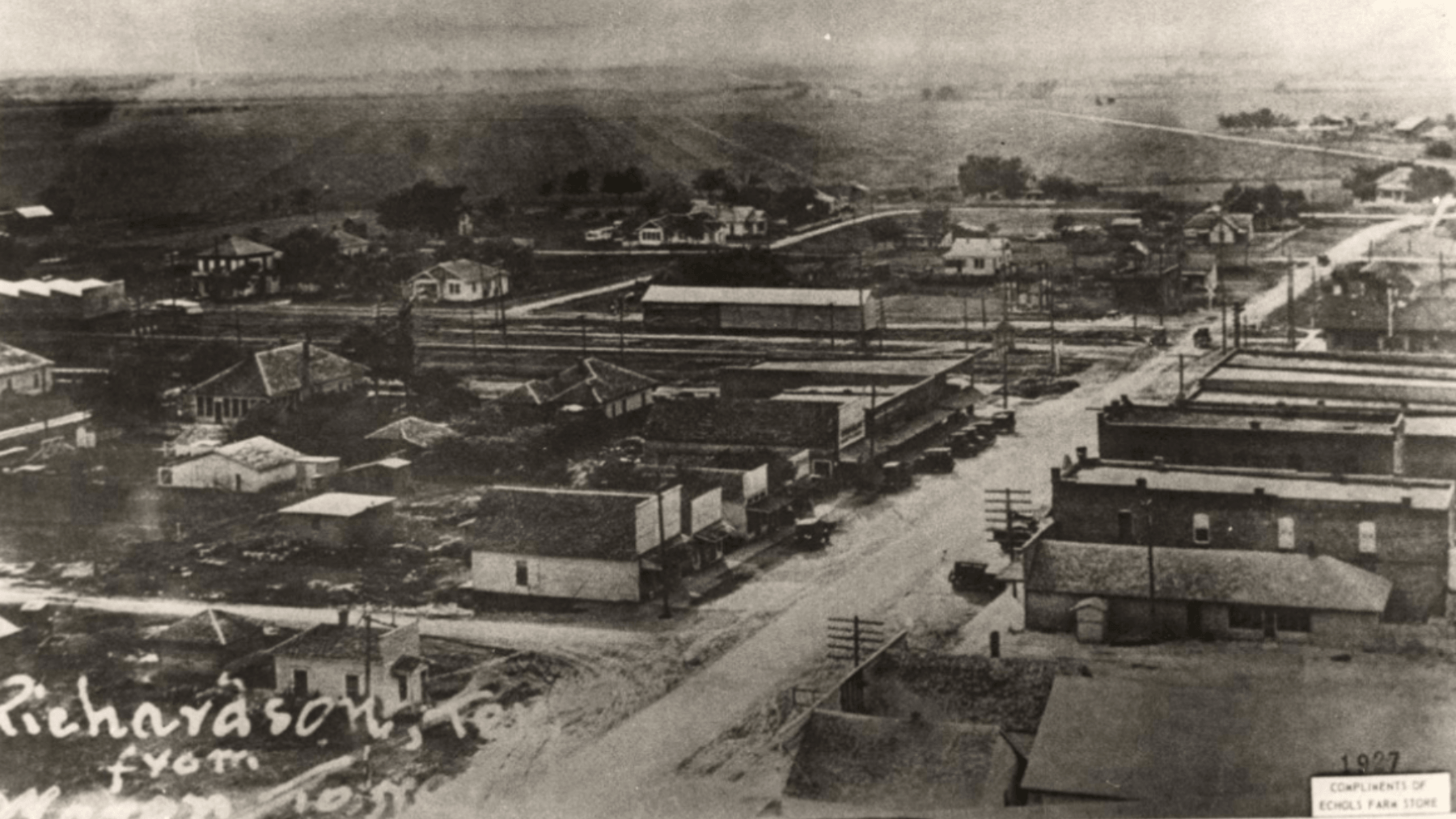 Historic aerial view of Richardson, Texas, showing Main Street, railroad tracks, homes and farmland during the town’s early growth