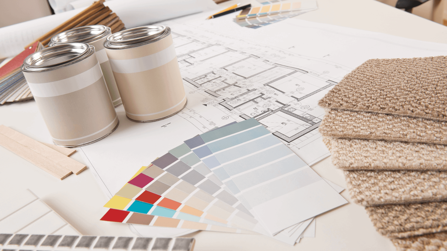 Paint color swatches, carpet samples and home plans illustrating how sellers can choose the right neutral paint colors before listing a home
