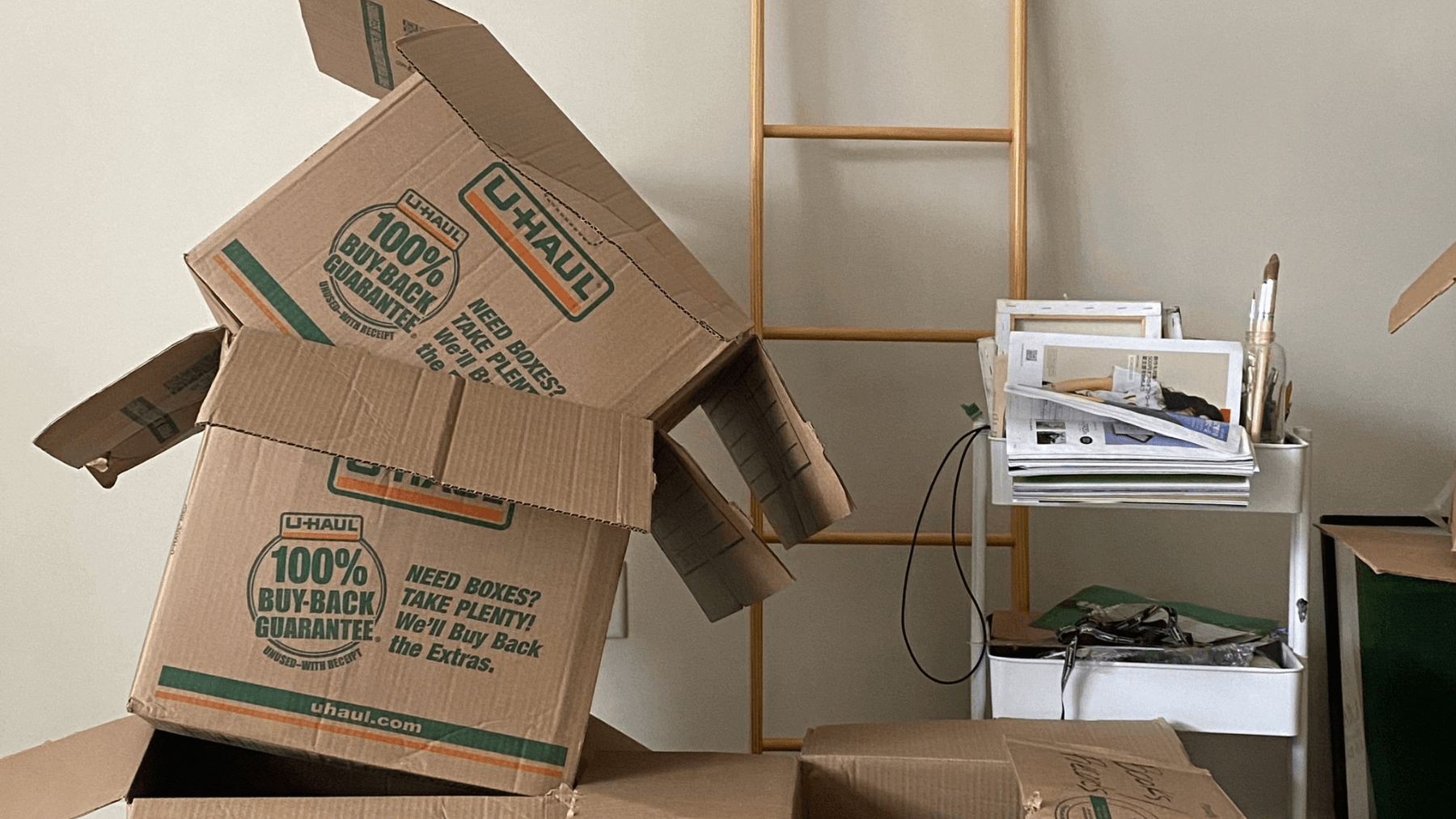 Moving boxes inside a home representing decluttering and staging before selling a house