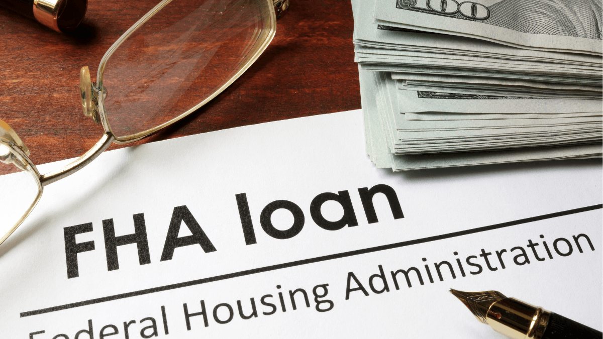 FHA loan paperwork with cash and financial documents illustrating FHA financing for North Texas home buyers
