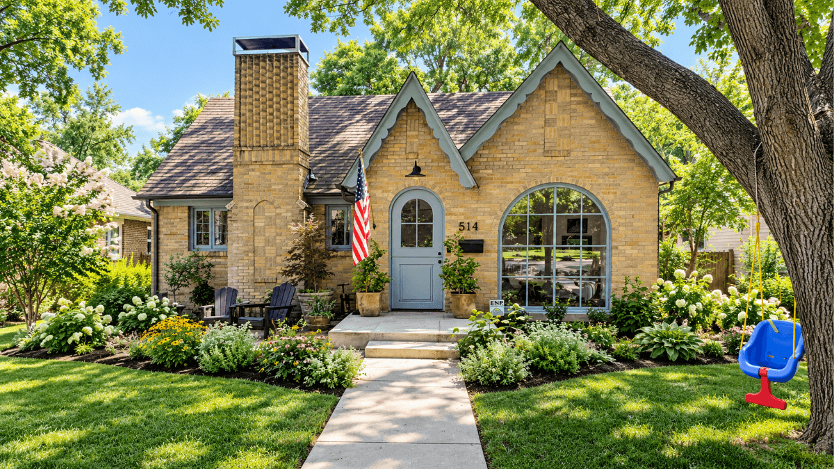 Historic Dallas brick home with original architectural details, mature trees and landscaped front yard