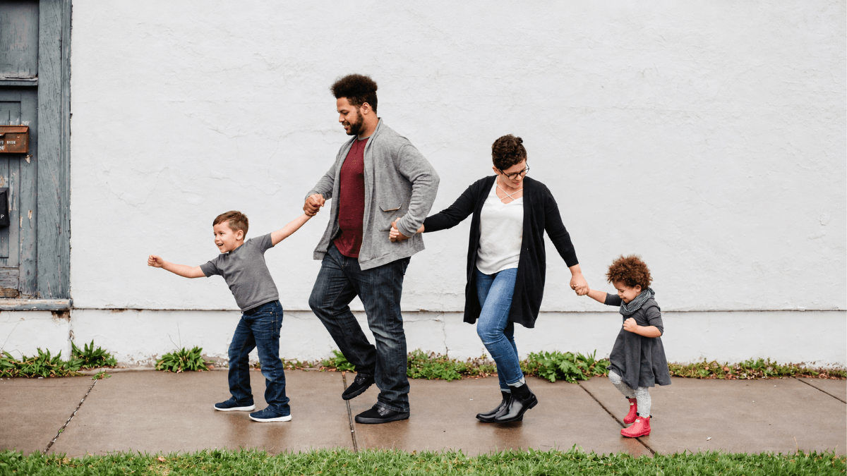 Family preparing for a Texas real estate closing, illustrating what first-time home buyers can expect during a closing appointment in Dallas and North Texas