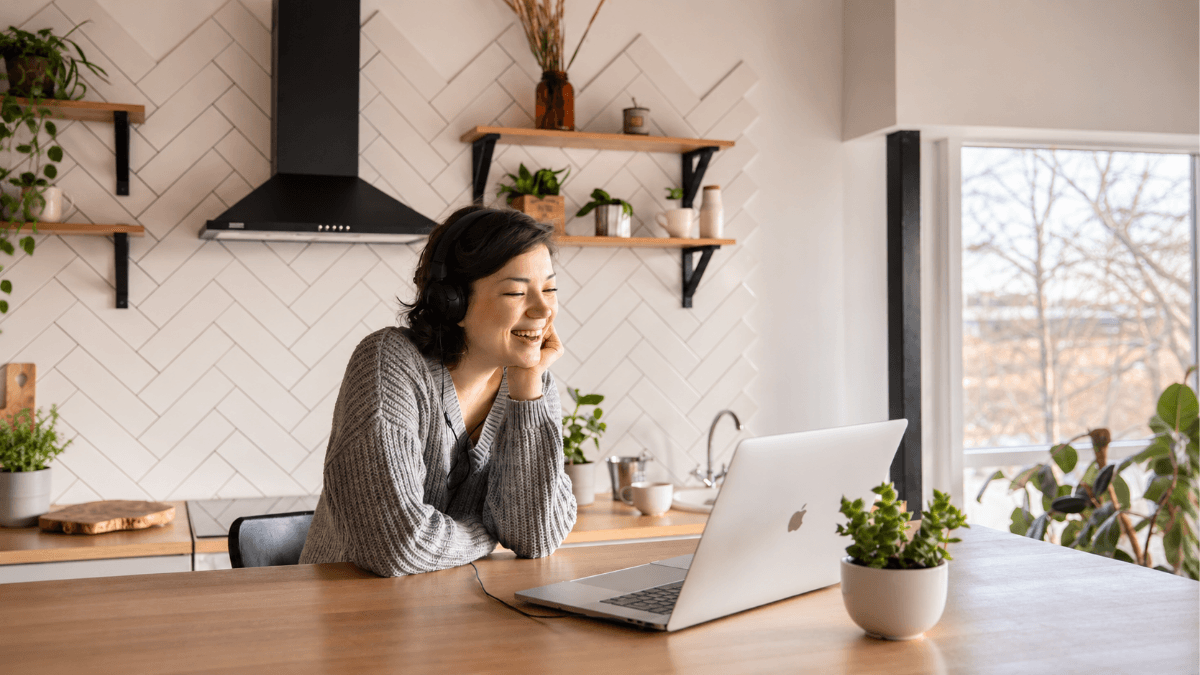 Homeowner reviewing real estate data on a laptop, illustrating how to read a Comparative Market Analysis, compare recent sales and understand home value in Dallas and North Dallas