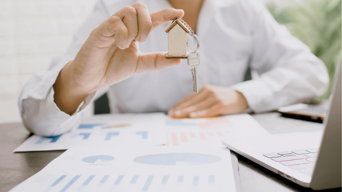 Home buyer holding house keys during a real estate transaction, representing how FHA, VA and conventional financing options can affect offer strength, appraisals, negotiations and closing success in the Dallas-Fort Worth housing market