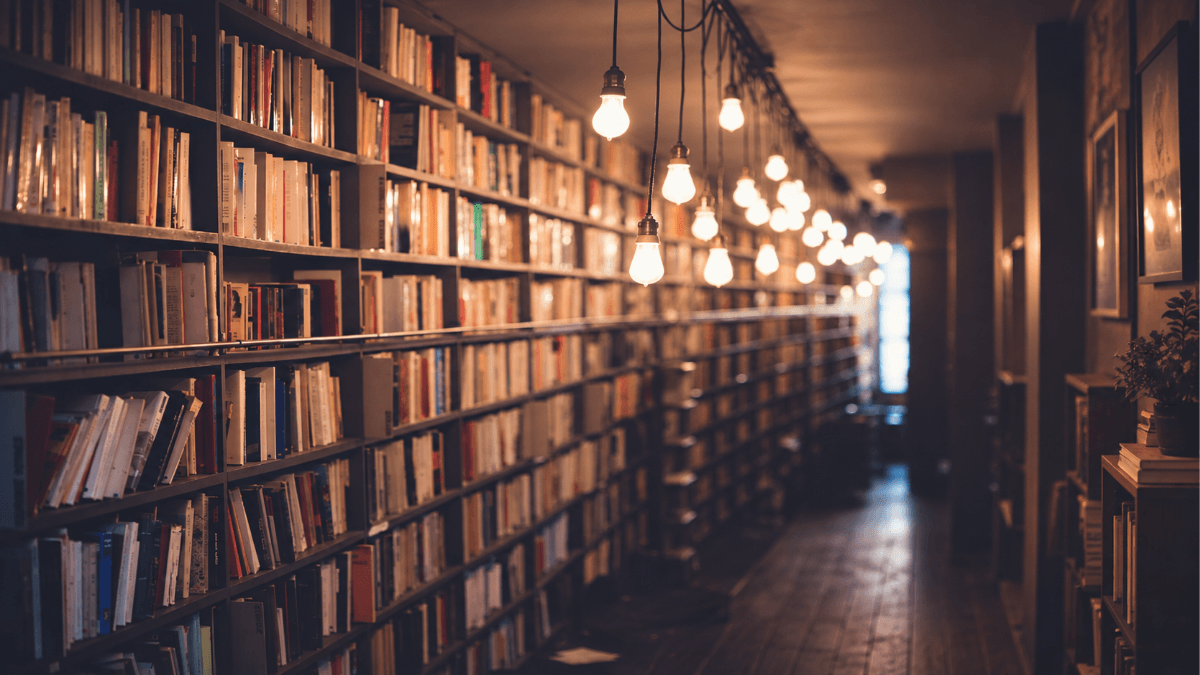 Warm library shelves and hanging lights representing Richardson ISD’s Graduate Profile and its focus on empowered learning, collaboration, reflection and creativity to prepare students for college, careers and life