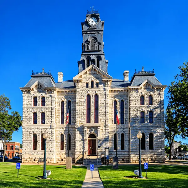 Part 3: Granbury, Texas. Historic Hood County Courthouse in downtown Granbury, Texas, highlighting the charming town square and historic architecture that make Granbury a popular day trip from Dallas.