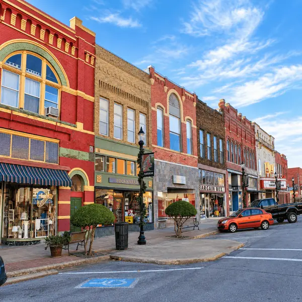 Part 10: Denison, Texas. Historic downtown Denison, Texas, with colorful brick storefronts and the Rialto Theater, highlighting the city’s architecture, shopping and small-town charm near Lake Texoma.