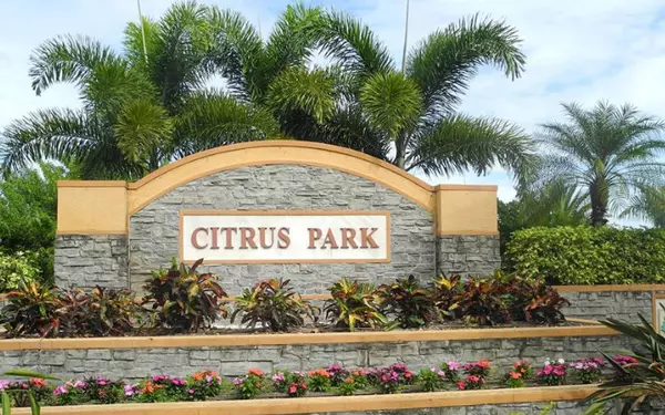 Citrus Park entrance sign in Tampa FL with palm trees and flowers, highlighting community lifestyle and homes for sale