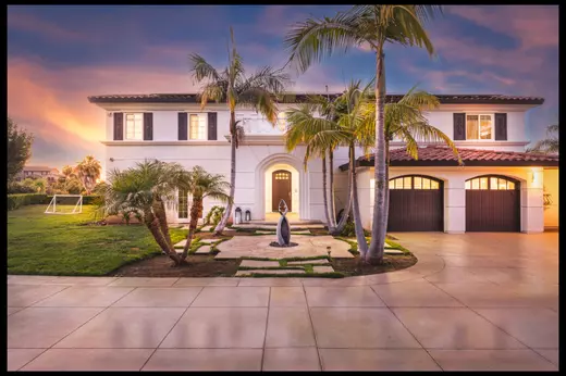 Front exterior view of 6129 Villa Medici in Bonsall, a luxury Southern California home sold by Realtor Patricia Villanueva, showcasing elegant architecture and lush landscaping.