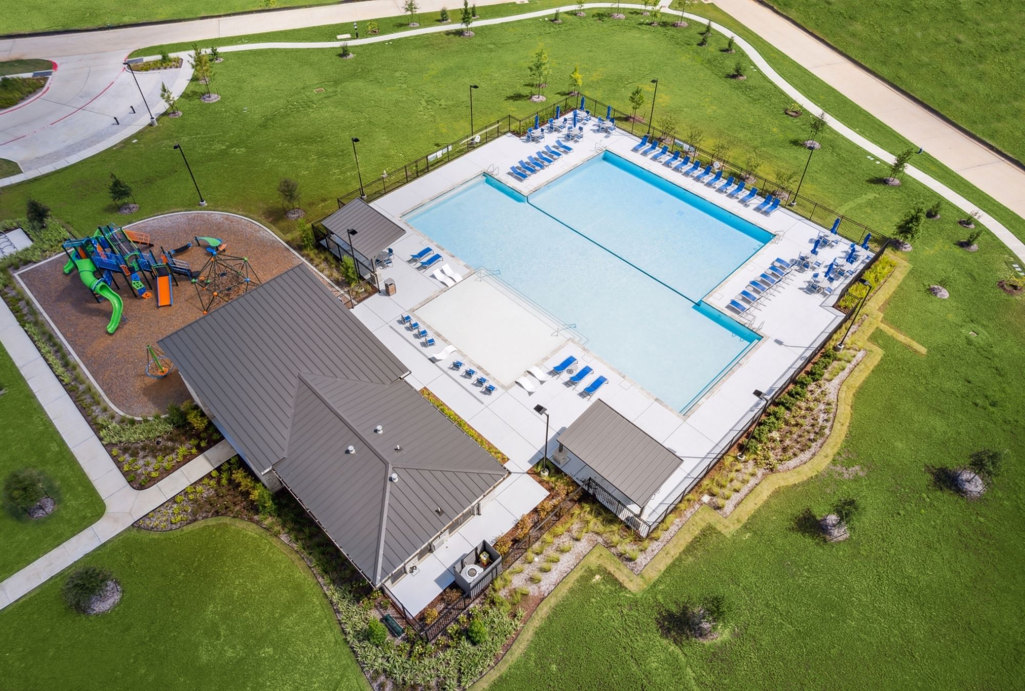 Neighborhood streets and homes in The Canopies community in New Caney, Texas with parks, pools and walking trails