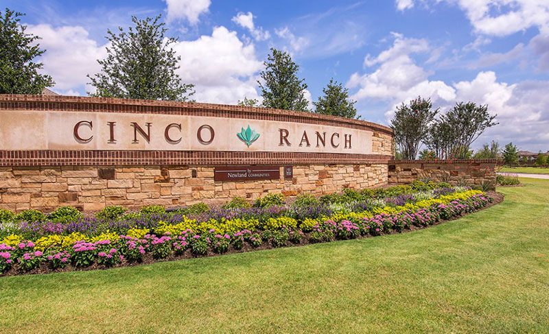 Cinco Ranch entrance sign and landscaped community gateway in Katy, T