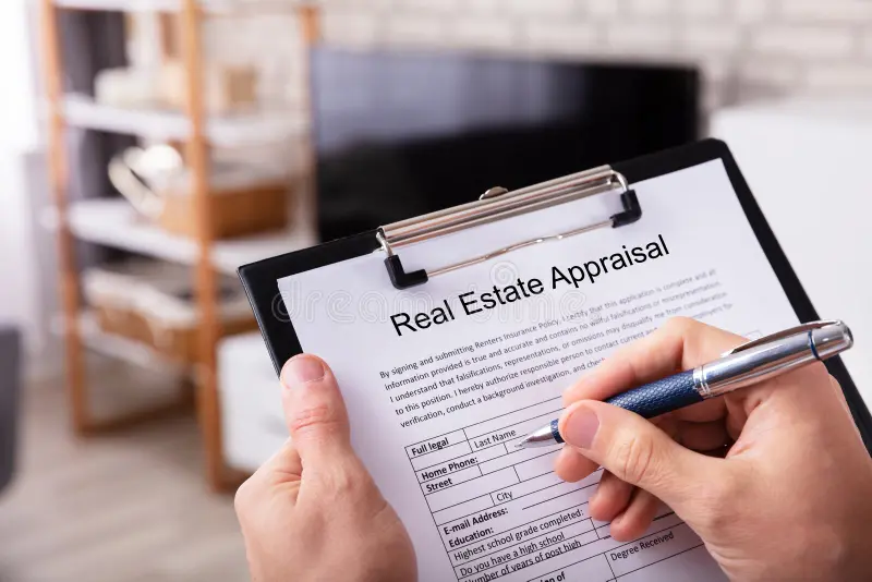 Appraiser assessing home value during Texas real estate appraisal