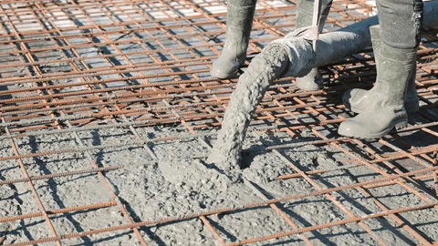 Concrete slab foundation being poured for a new construction home in Texas