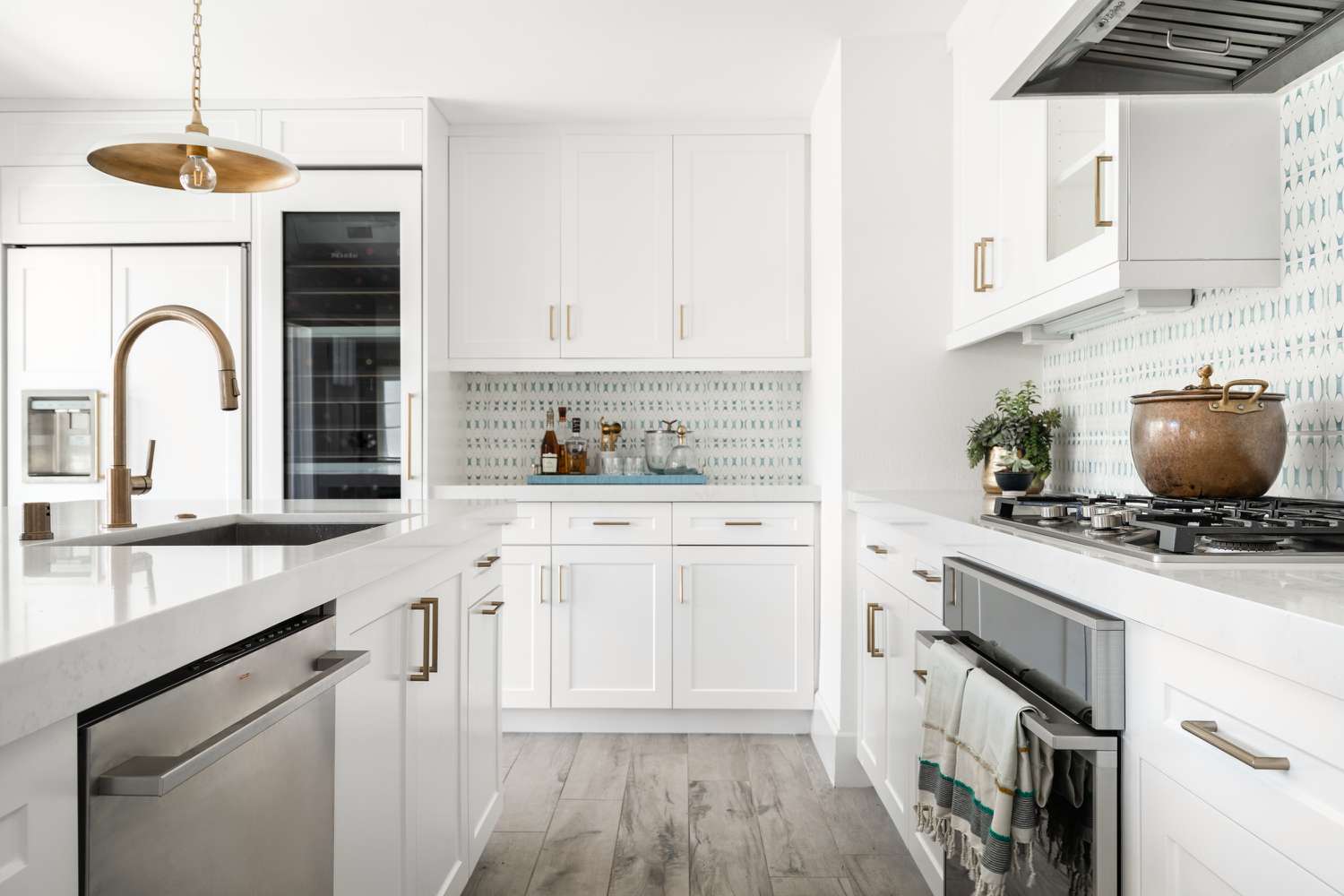 Bright modern kitchen with painted cabinets and updated lighting in Katy TX
