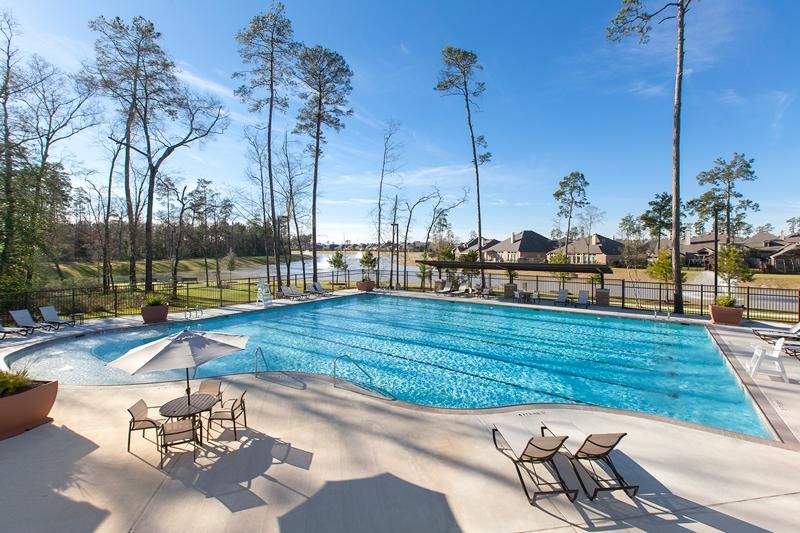 The Falls at Imperial Oaks neighborhood in Spring TX with lakes, trails, and family homes