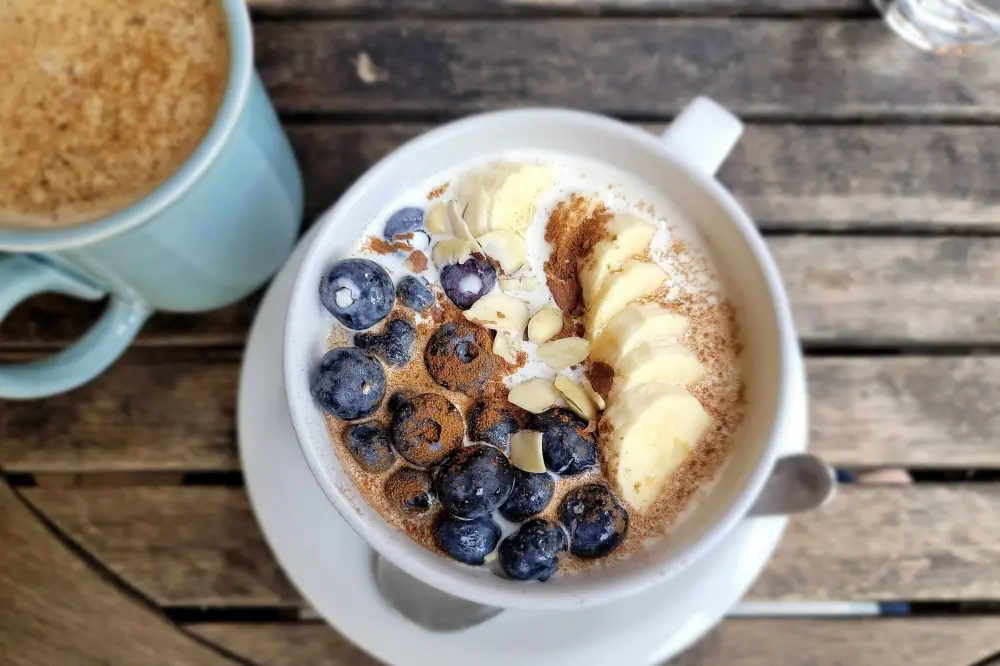Outdoor seating and farm-to-table dining at Season's Harvest Café in Cypress, Texas, a locally owned café known for its peaceful setting, fresh ingredients and popular brunch menu.