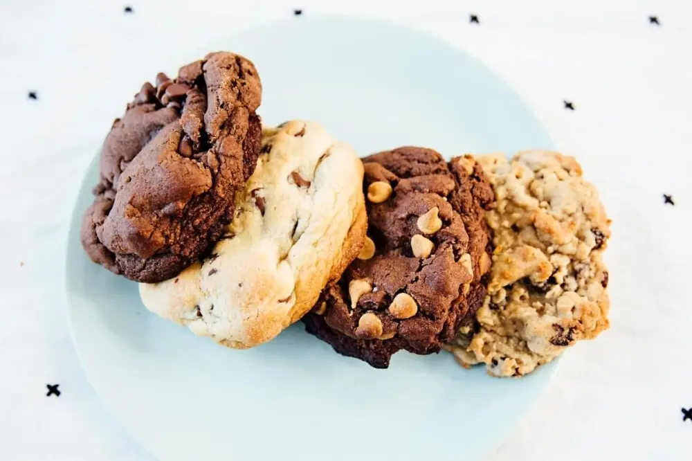 Freshly baked cookies and specialty desserts at Half Baked Goodness in Cypress, Texas, a local bakery known for oversized cookies and decadent sweet treats.