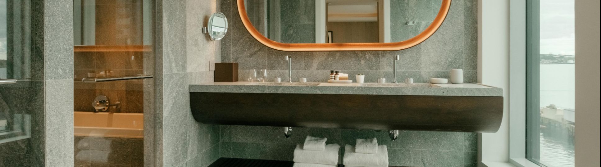 Fresh, staged bathroom in a Halifax home with white towels and modern fixtures.