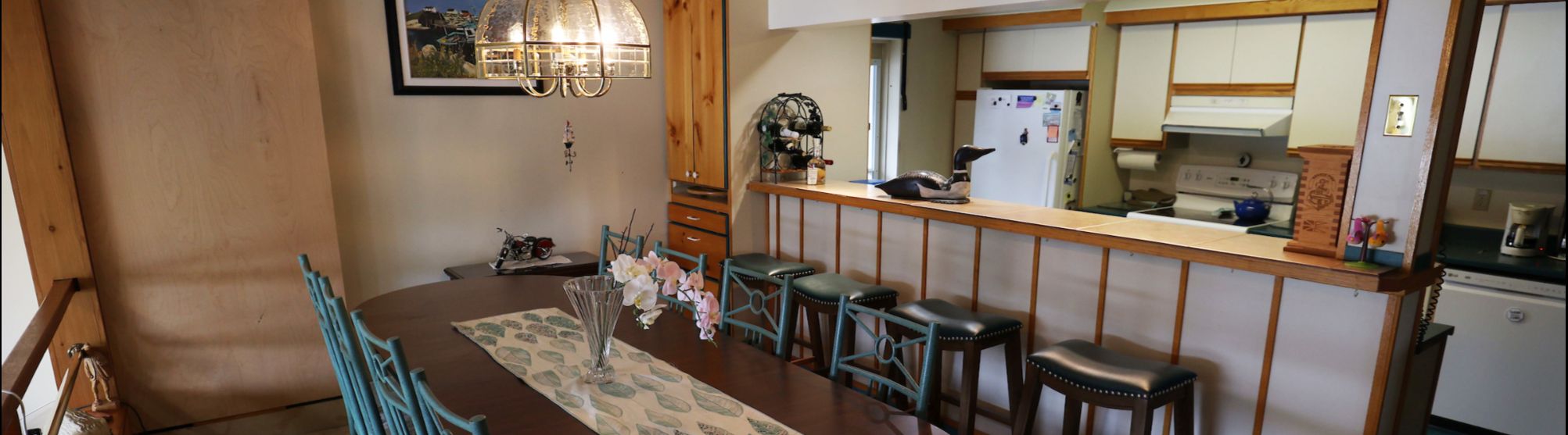 Staged Halifax dining room with bright natural lighting and modern table settings.