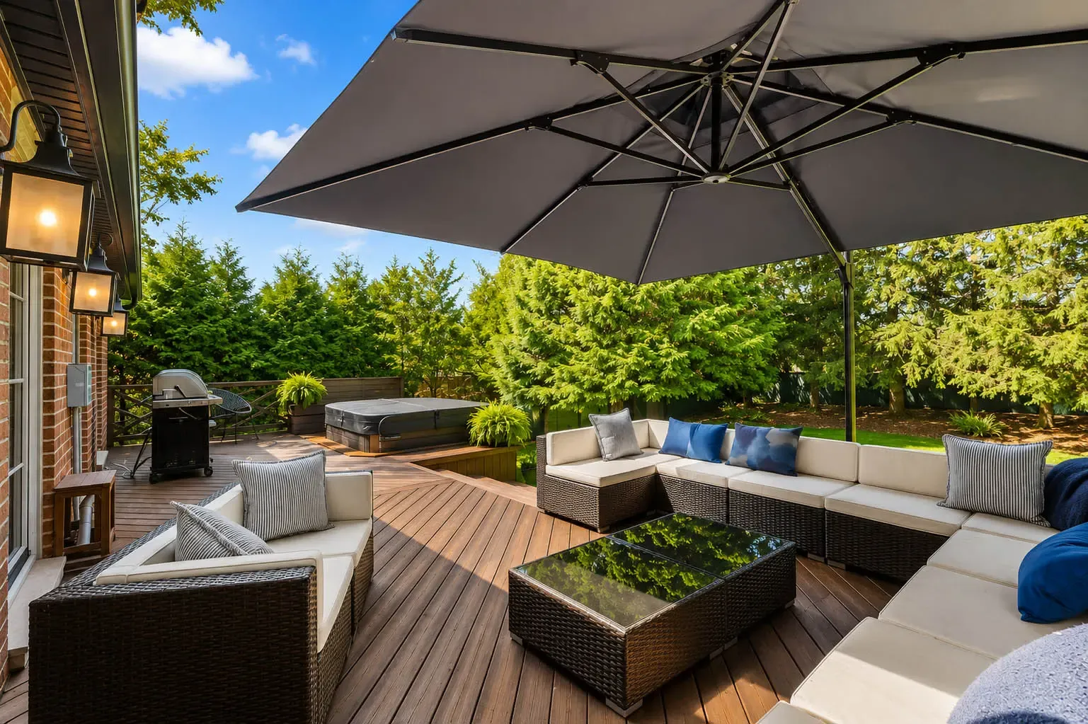 Outdoor lounge with sectional seating and cantilever umbrella at 816 Norwick Road