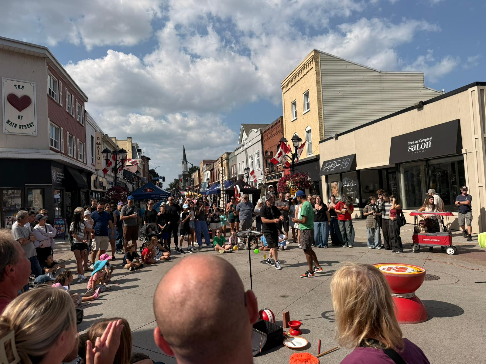 Crowd watching street entertainment at Summerfest on Main in Newmarket Ontario