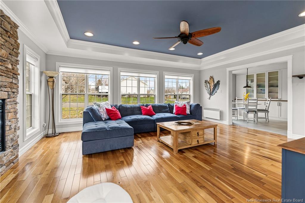 Wide interior living room photo showing hardwood floors and natural light