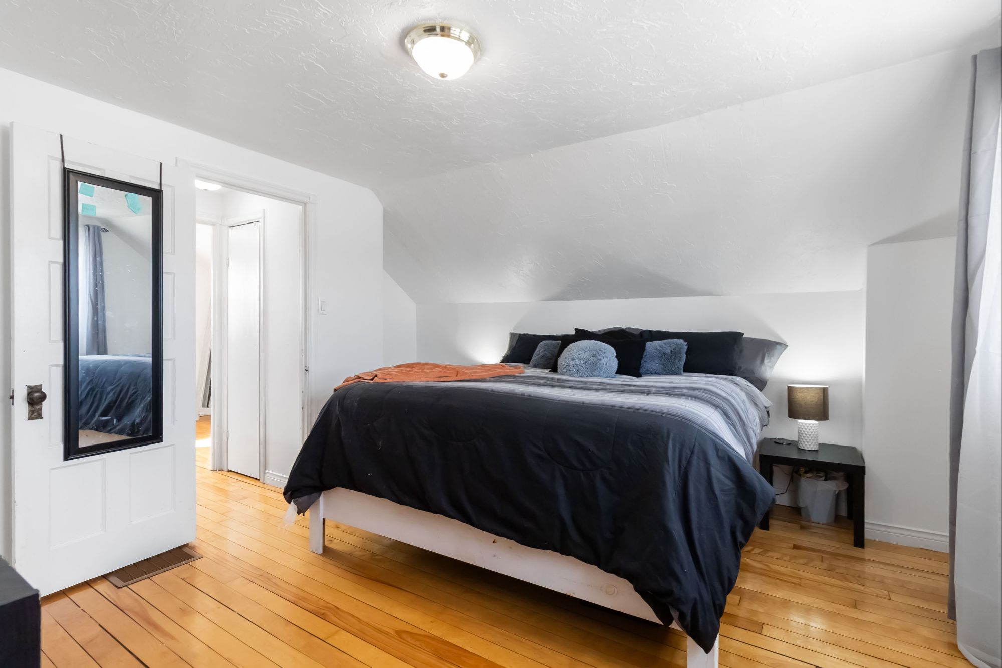 Primary Bedroom with Hardwood Floors - 27 Airport Street Dieppe NB