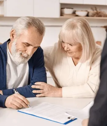 couple selling home signing listing agreement david bell realtor