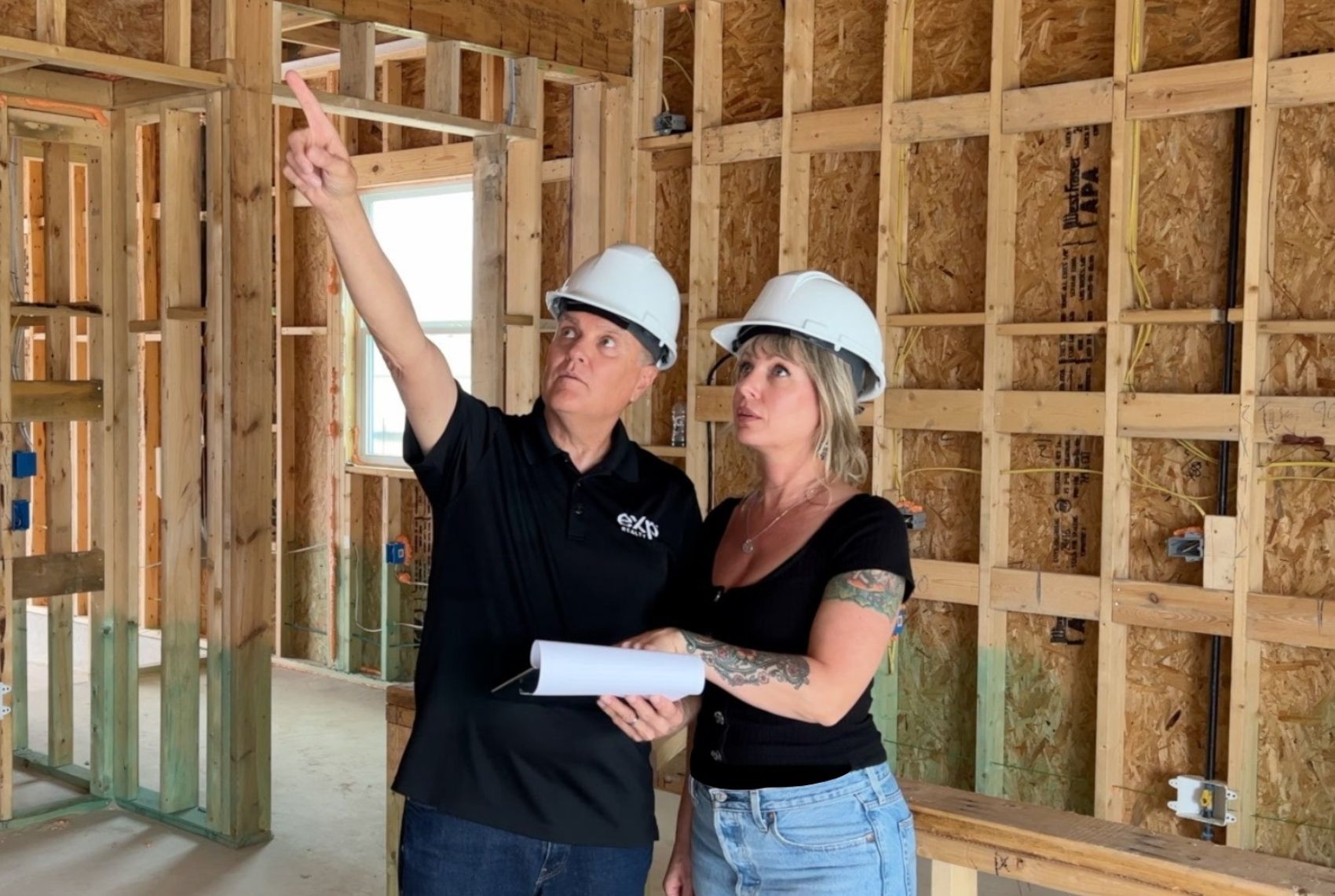 James and Danielle Haddox reviewing new home construction during an Austin home search
