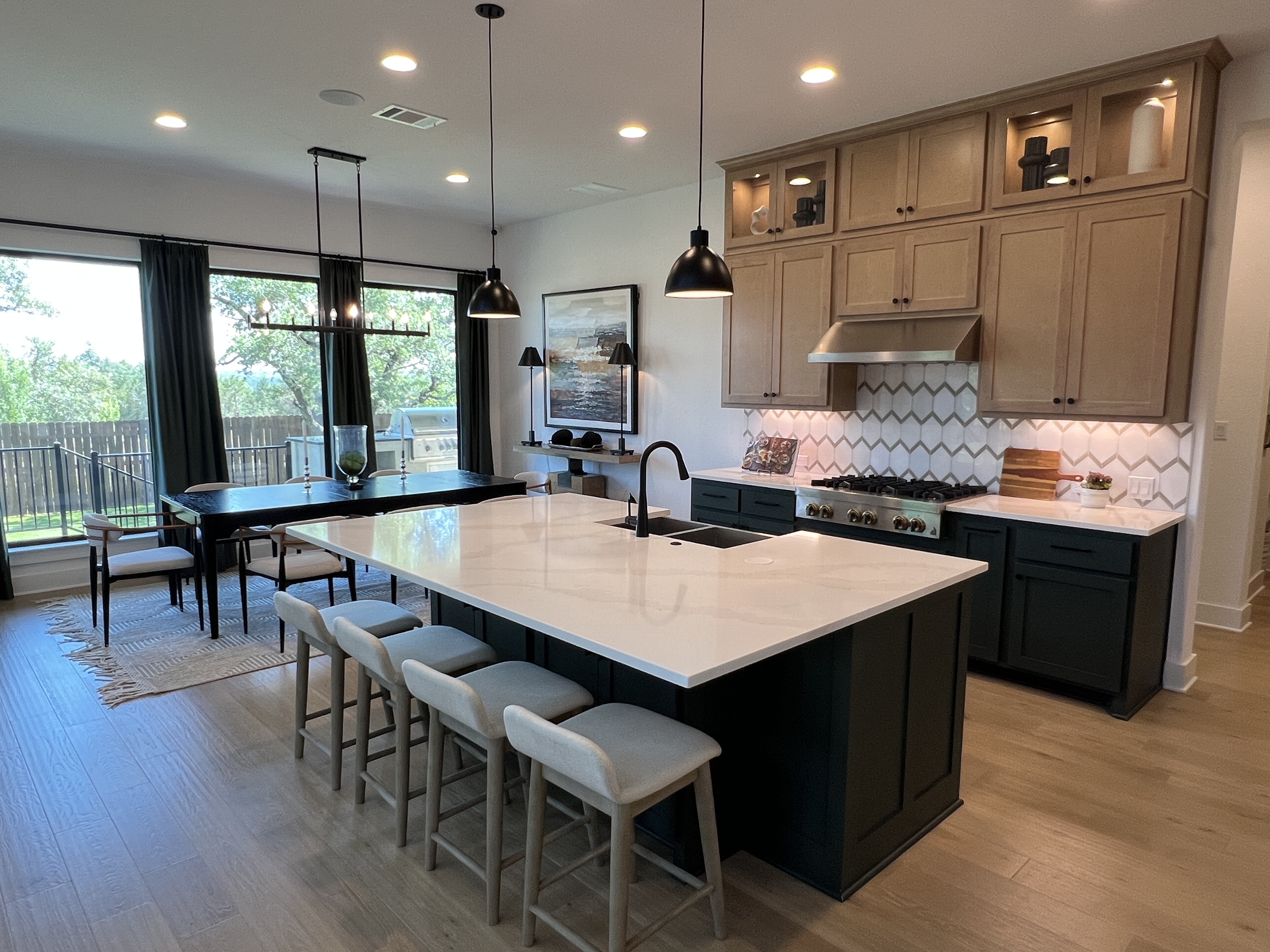 Giddens Homes model kitchen and dining room in Riverstone Georgetown TX