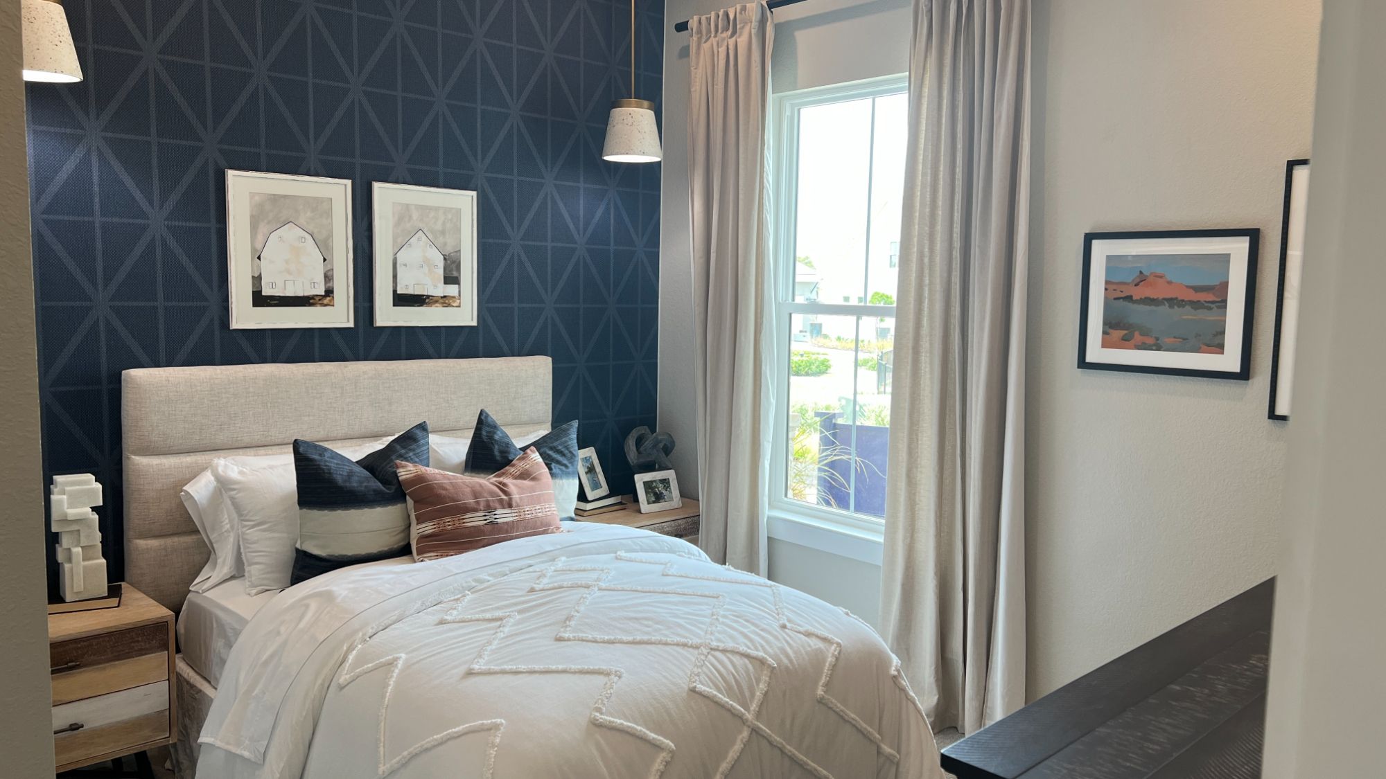 Guest bedroom inside the Blanton model home at Regency at Santa Rita Ranch in Liberty Hill Texas