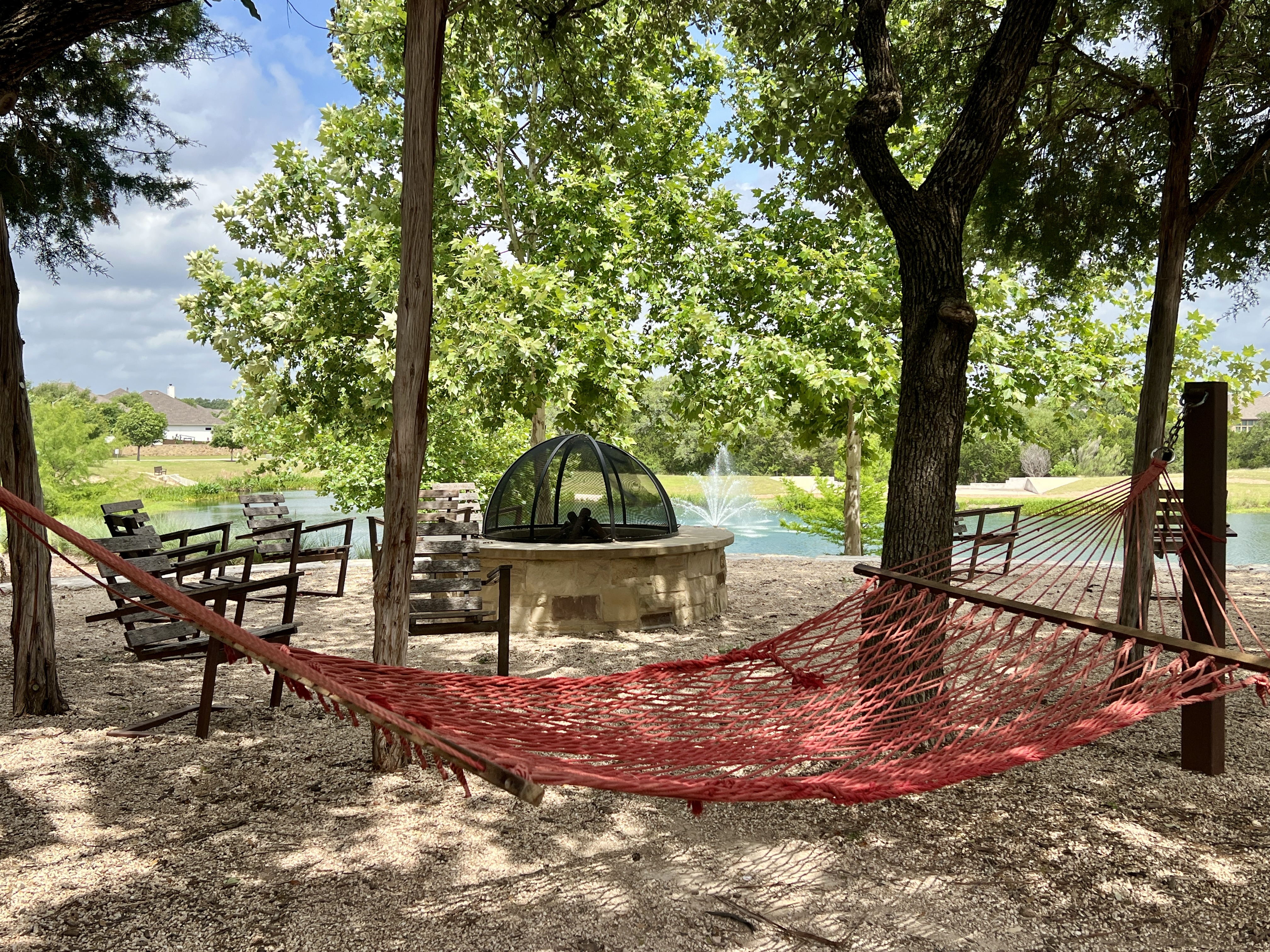 Fire pit seating area at The Backyard amenity center in Bryson Leander Texas