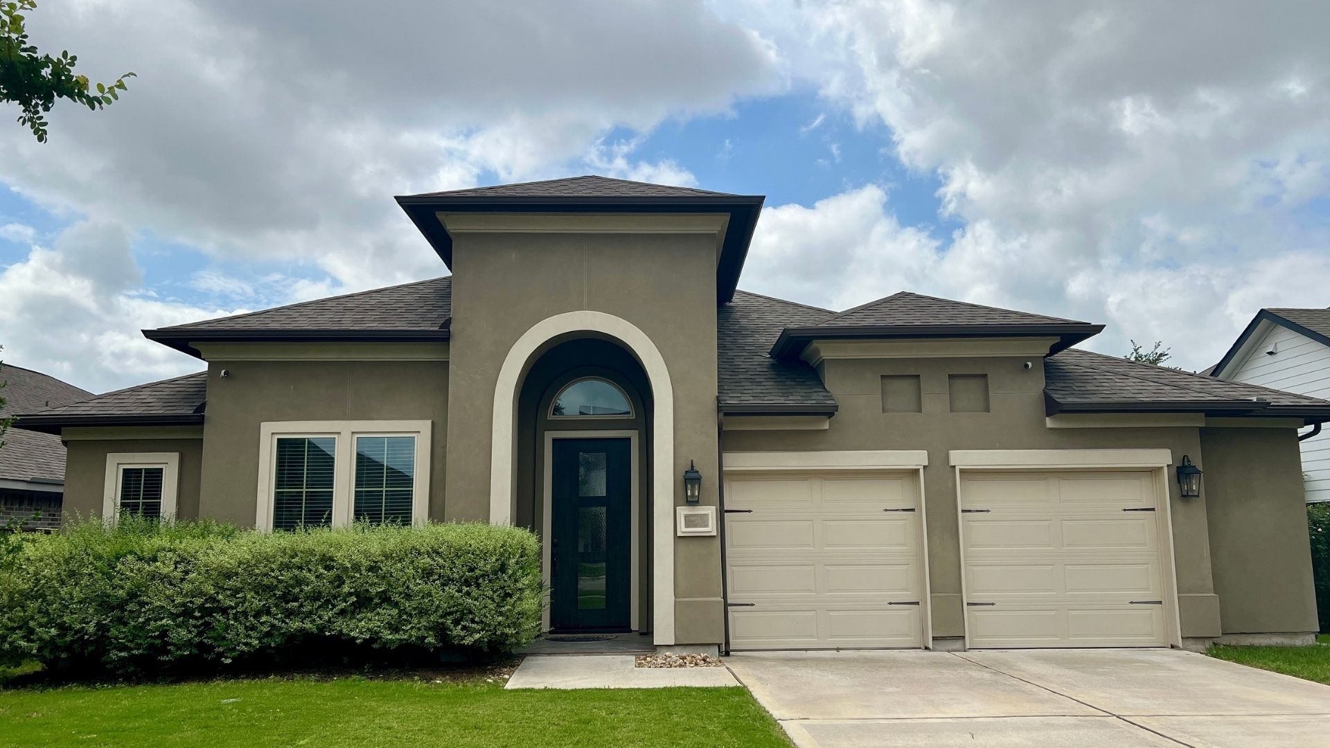 Bryson master-planned community home in Leander Texas with attached garage and suburban curb appeal