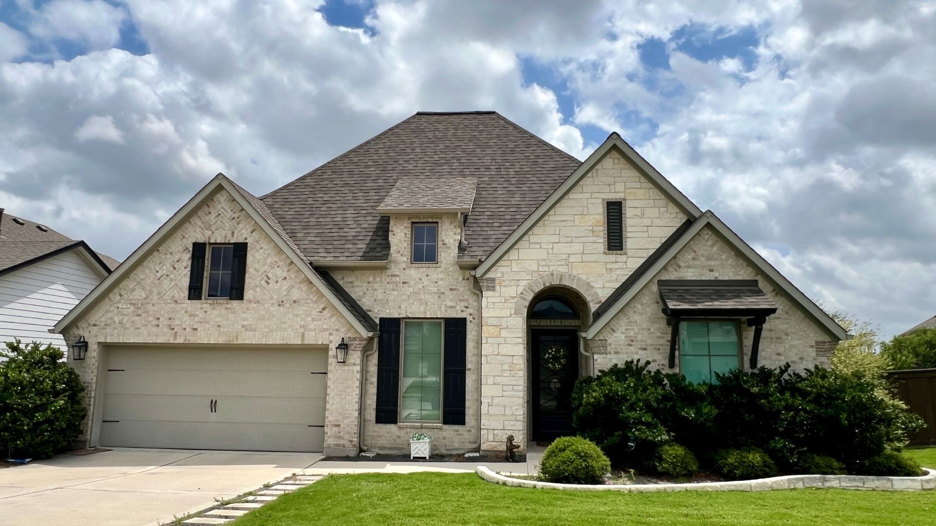Single-family resale home in Bryson Leander Texas with clean exterior design and attached garage