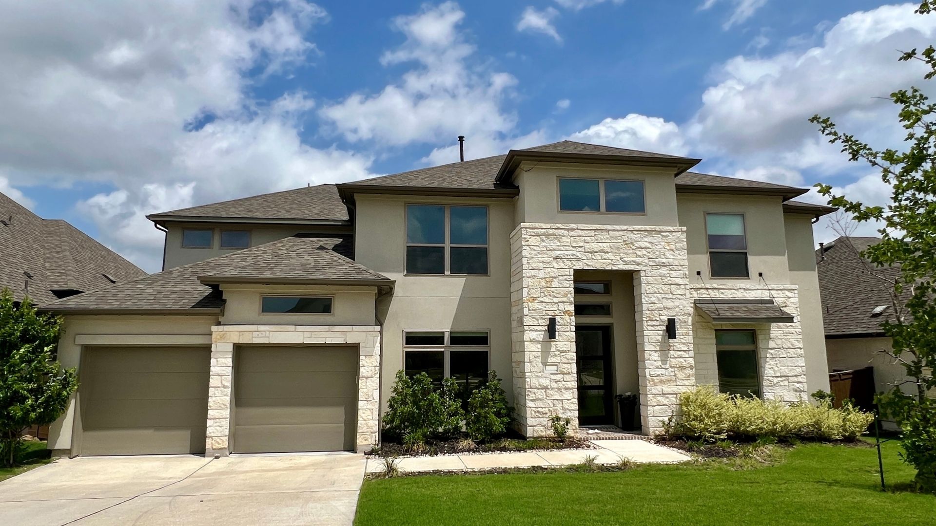 Home exterior in Bryson Leander Texas showing modern design and established neighborhood landscaping