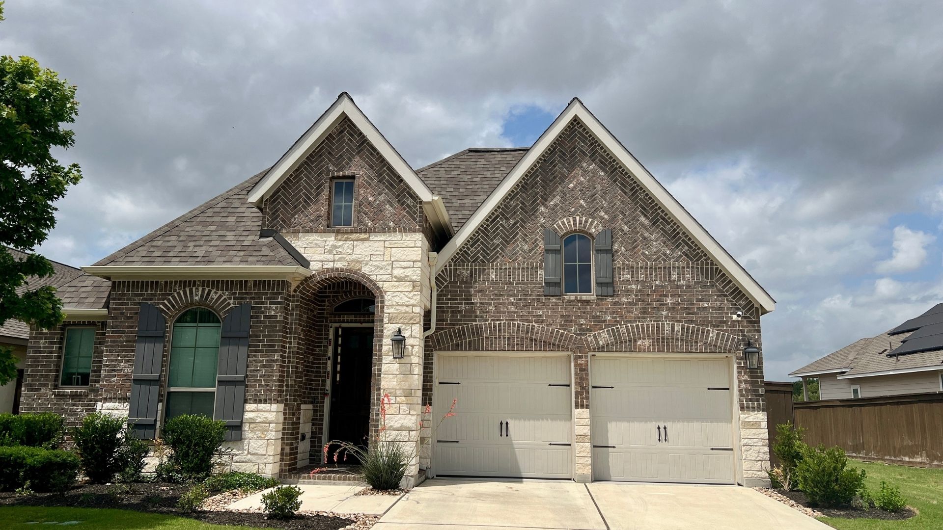 Bryson home exterior near 183 in Leander TX with landscaped front yard and modern finishes