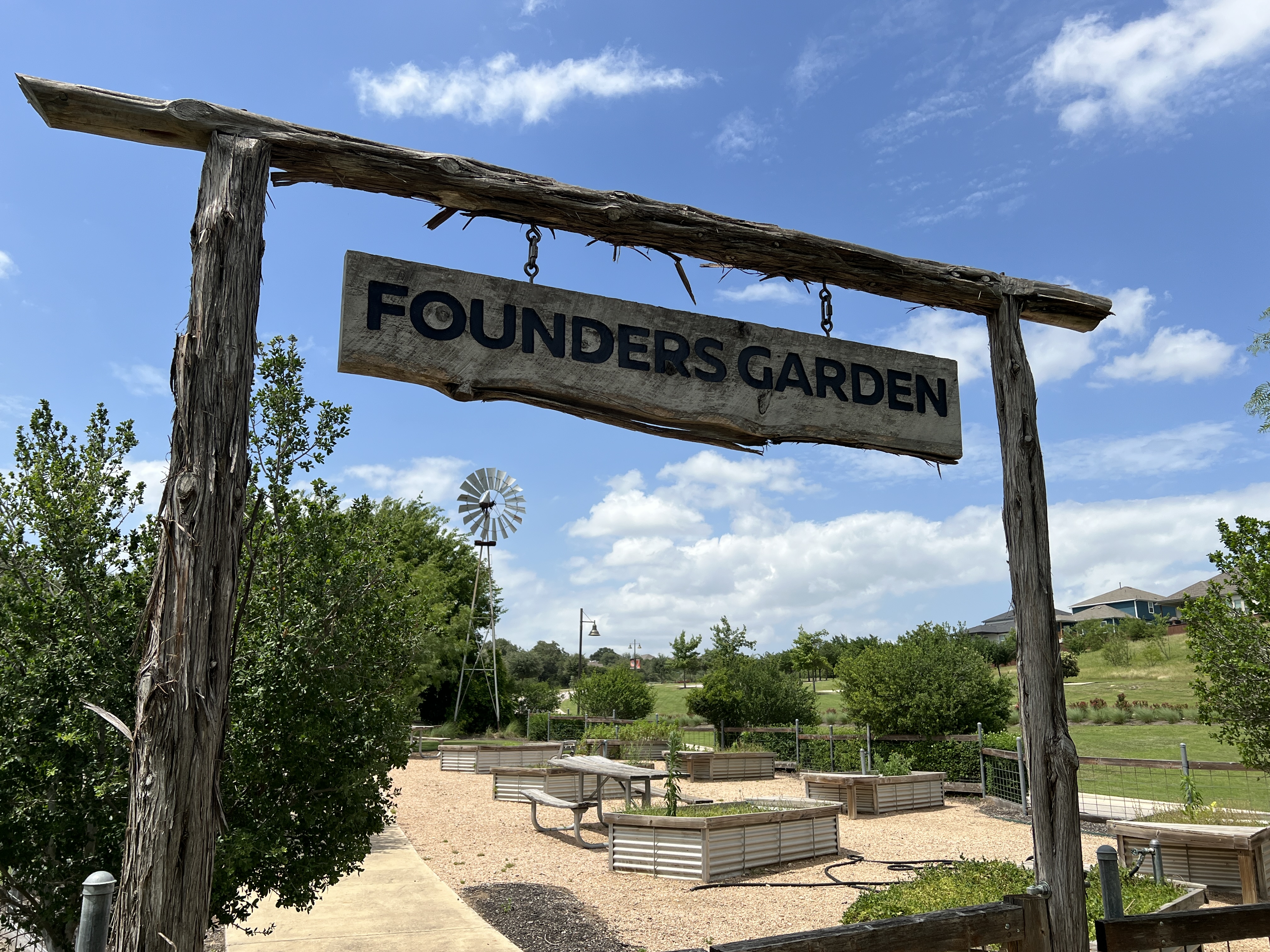 Founders Garden community garden area in Orchard Ridge Liberty Hill Texas with raised planting beds and neighborhood green space
