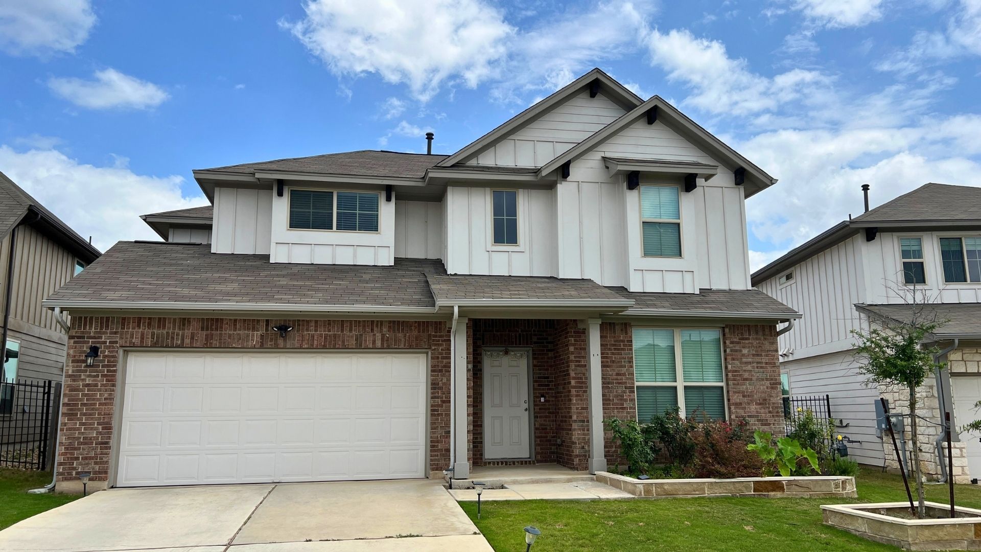 Single-family resale home in Larkspur Leander TX with covered entry and landscaped yard