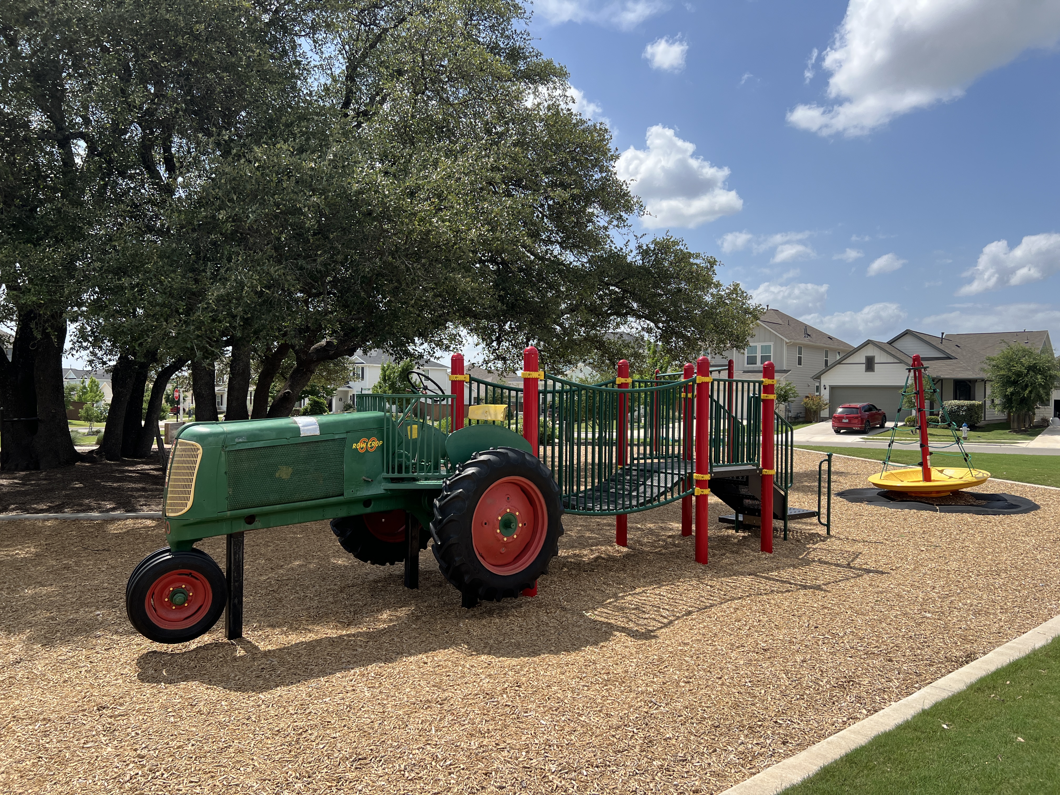Farm-themed playground at Orchard Ridge Liberty Hill Texas with tractor play structure and family-friendly community amenities